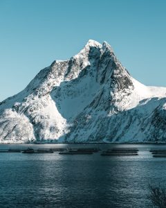 icy mountain and a lake, representing altitude and humidity