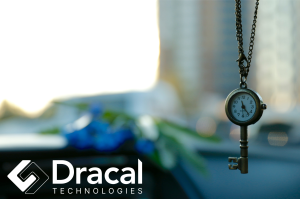 Key with a watch, and Dracal Technologies logo